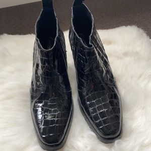 Black patent chunky heel ankle boot.